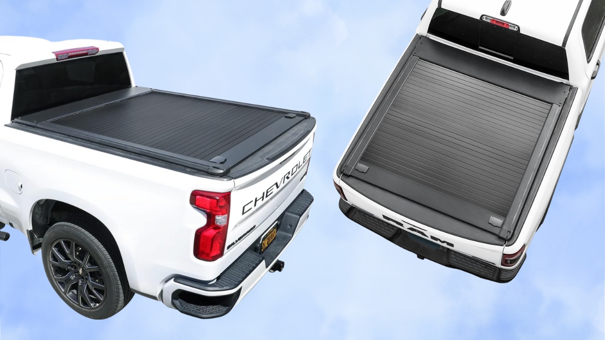 Two white pickup trucks with black retractable tonneau covers installed, shown from a top rear view.