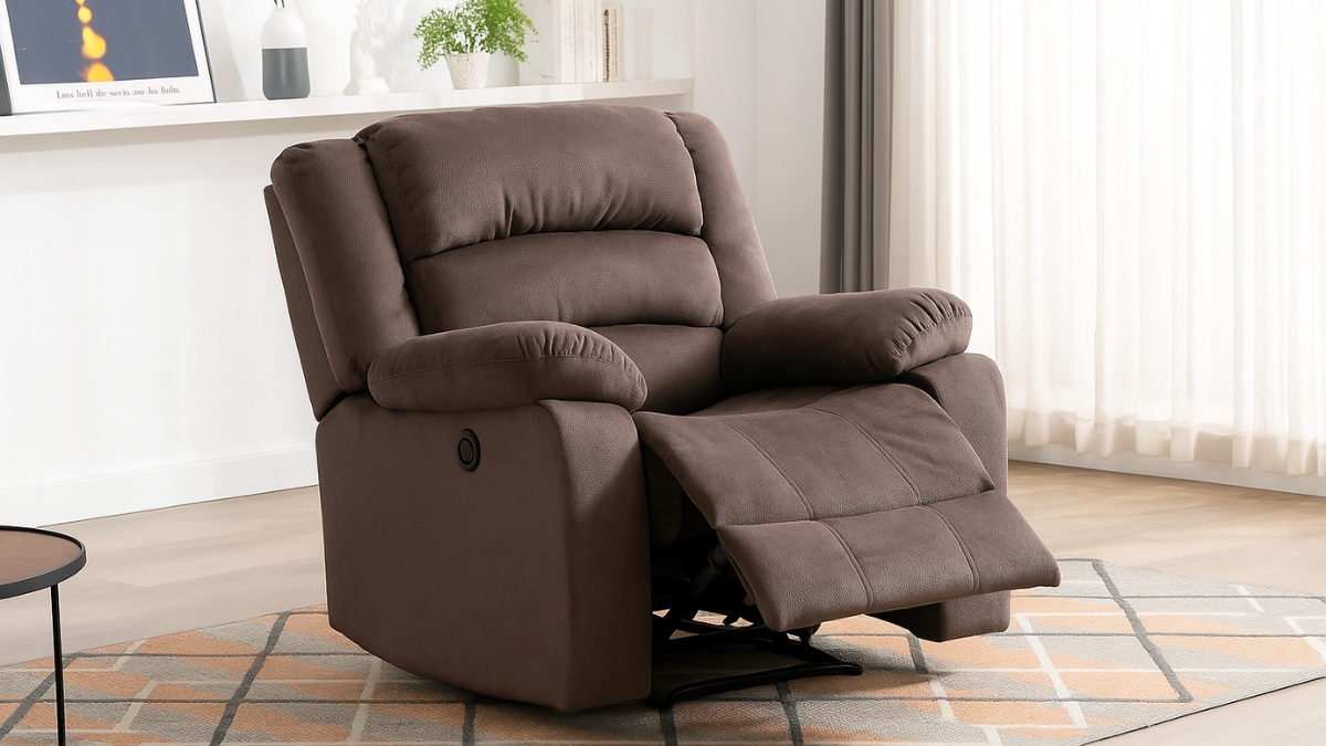 Brown power recliner chair with a soft cushion and footrest shown in a bright living room.