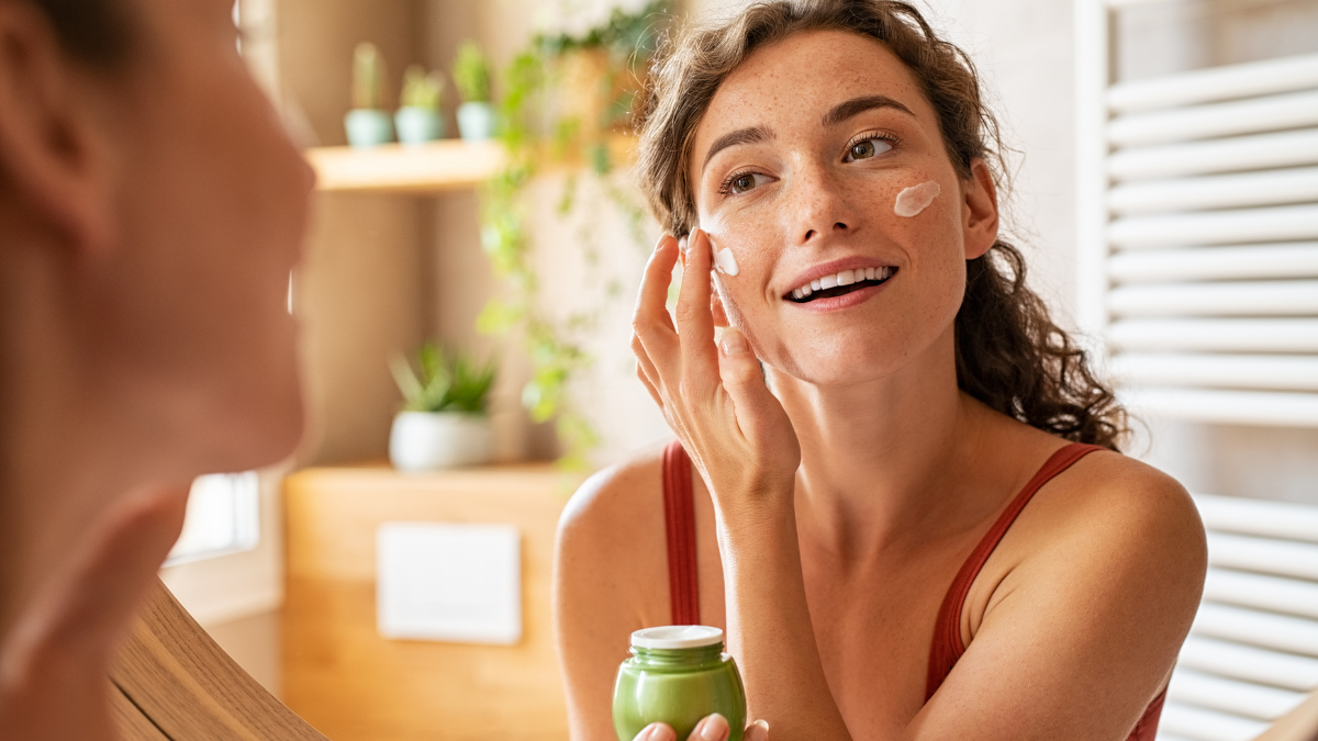 Anti-aging skincare routine with cleanser, serum, moisturizer, and sunscreen for daily healthy-looking skin care.